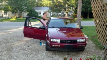 The wife giving the car her first wash