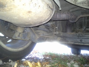 Left rear suspension/muffler