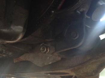 image1(2).JPG (772.84 KiB) Viewed 14394 times The tranny mount. This plate is bolted to the bottom of the Muncie out of the way. The large bolt (from the original mount of an older Beretta) is pinned-down on the other end by a rubber-coated aluminum saddle that is in turn bolted to the subframe.